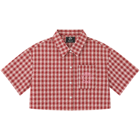 Front view of INTROVERT women's cropped short sleeve flannel shirt in cherry red and cream plaid featuring a distinct flat crop hem and pink rose outline embroidery on the pocket.