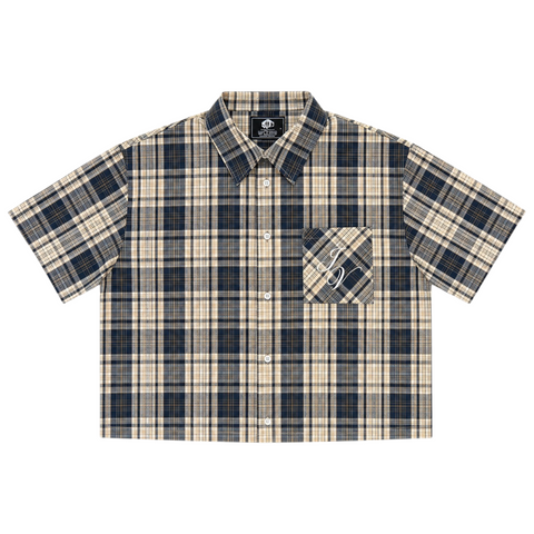 Front view of INTRV "Story" short sleeve charcoal-navy and tan plaid flannel shirt featuring a flat-hem cropped profile and diagonal patch pocket with white cursive script embroidery.