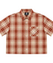 Front view of INTRV "Story" short sleeve red-brown and beige plaid flannel shirt featuring a relaxed boxy fit and a diagonal chest pocket with white cursive monogram embroidery.