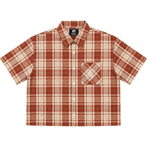 Front view of INTRV "Story" short sleeve red-brown and beige plaid flannel shirt featuring a relaxed boxy fit and a diagonal chest pocket with white cursive monogram embroidery.
