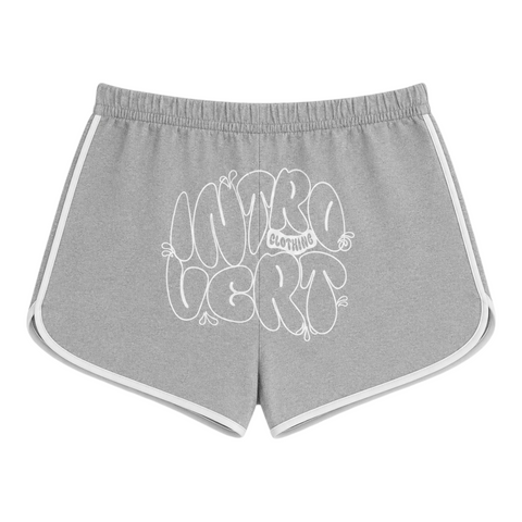 Back view of INTROVERT women's retro track shorts in grey heather showcasing a large white screenprinted INTROVERT CLOTHING bubble text graphic across the seat.