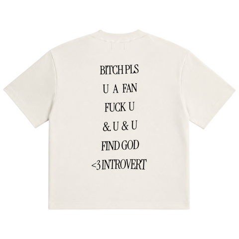 Back view of INTROVERT oversized short sleeve tee in off-white highlighting the large black stacked text graphic reading BITCH PLS U A FAN FUCK U & U & U FIND GOD <3 INTROVERT.