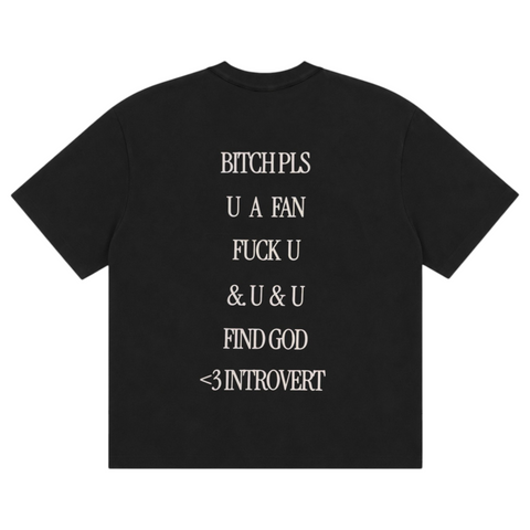 Back view of INTROVERT oversized short sleeve tee in vintage black highlighting the large cream stacked text graphic reading BITCH PLS U A FAN FUCK U & U & U FIND GOD <3 INTROVERT.