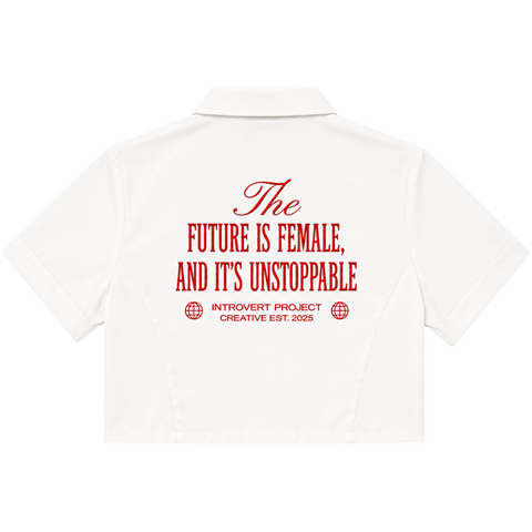 Back view of INTRV Unstoppable women's crop short sleeve shirt in white highlighting the bold red typography graphic print reading The Future Is Female And It's Unstoppable with the Introvert Project Creative motif.